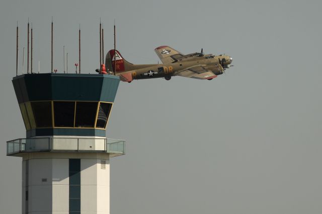 Boeing B-17 Flying Fortress — - A b-17 flies past the tower at Wilmington, DE.