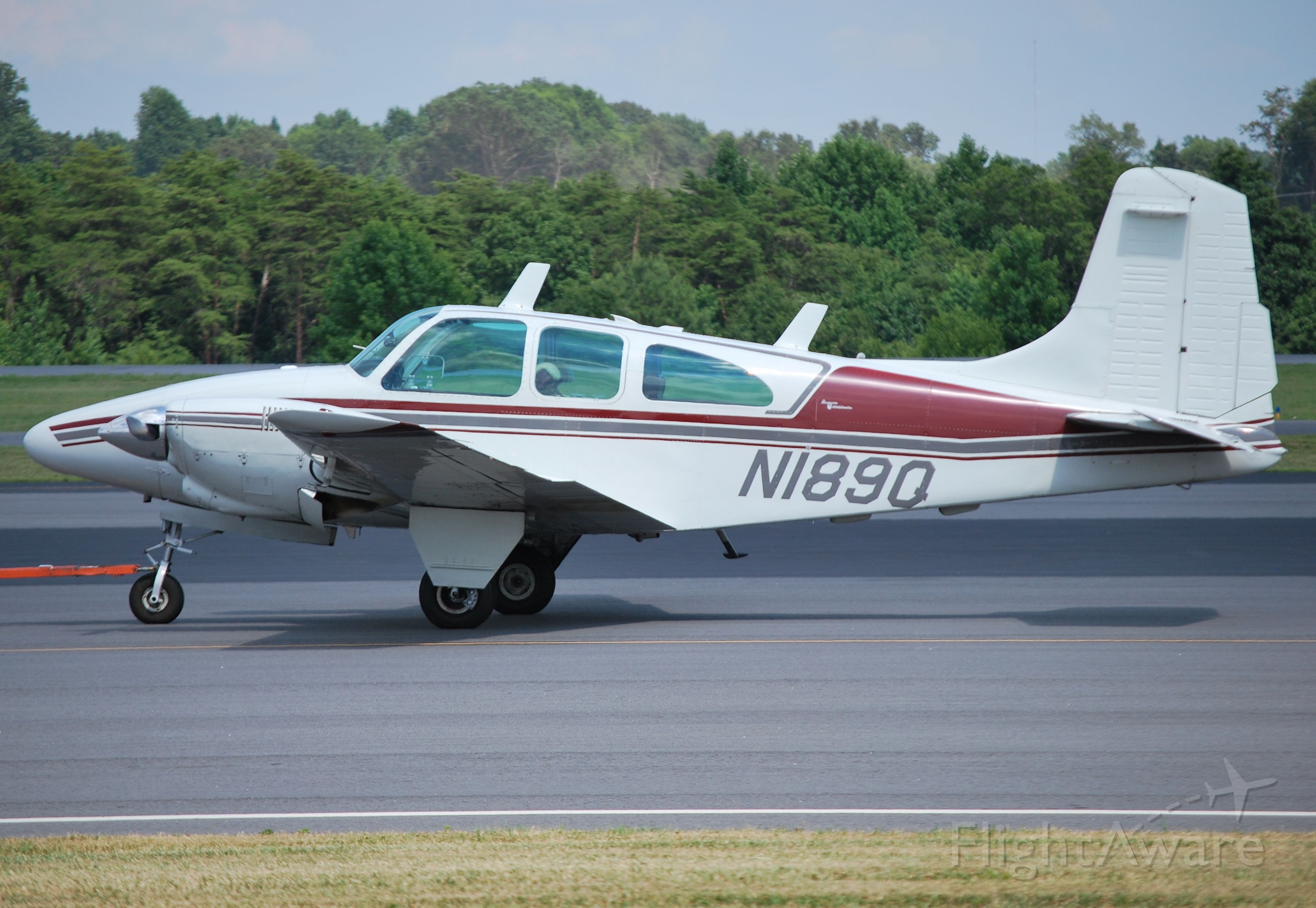 Beechcraft Travel Air (N189Q) - TRAVELAIR LLC in-tow at KJQF - 7/17/14