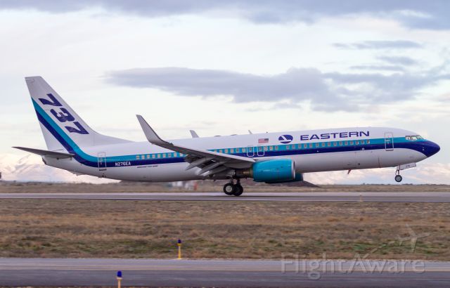 Boeing 737-800 (N276EA) - Just about to grease the mains as this Eastern 737 arrives in Ogden to pick up the Weber State basketball team for their tournament game in St. Louis.