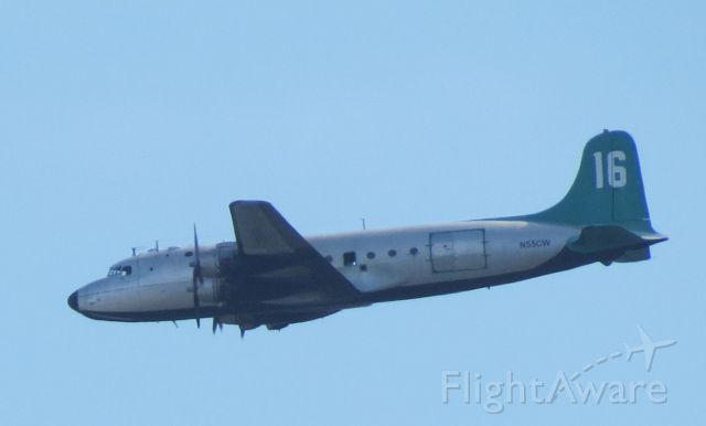 Douglas C-54 Skymaster (N55CW) - Photo shot from backyard  using Canon Powershot SX40HS. Plane appears to be on approach to Sarasota Bradenton Airport.
