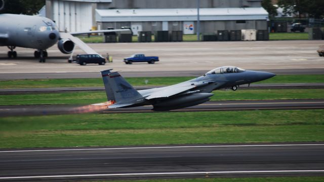 — — - An F-15C Eagle taking off in afterburner to head out for some weekend training.