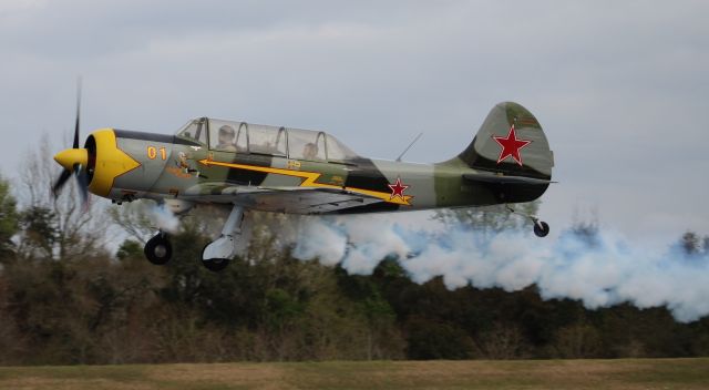 YAKOVLEV Yak-52 (N52SD) - An S C Aerostar Yakovlev YAK-52TW generating smoke on departure from H.L. Sonny Callahan Airport, Fairhope, AL during the Classic Jet Aircraft Association 2019 Presidential Fly-In and Convention - March 2, 2019.