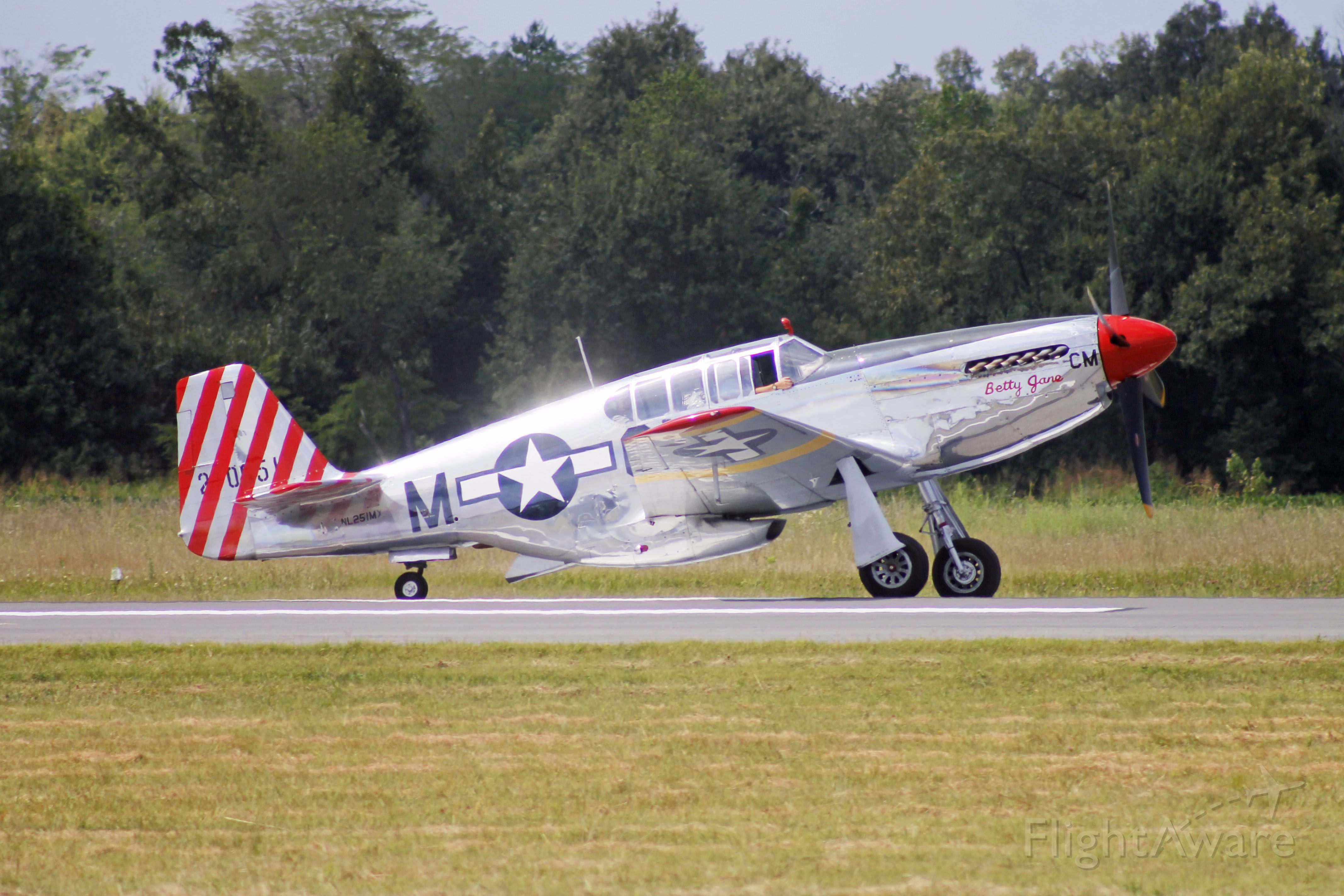 — — - P-51 Mustang readies for departure.