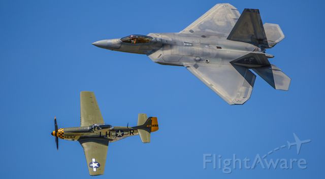 North American P-51 Mustang (N251PW) - P-51D Mustang "Baby Duck" (N251PW) in formation along with the Lockheed-Martin F-22 Raptor (02-4032) during the Heritage Flight at the Dayton Air Show.
