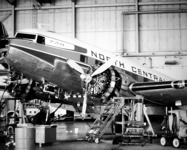 N21728 — - Now at the Henry Ford Museum, Ol' "728" is seen here in the North Central Airlines hangar undergoing maintenance. By this time, the world's highest time DC-3 (83,000+ hours) was withdrawn from passenger service and was being used as a corporate transport.