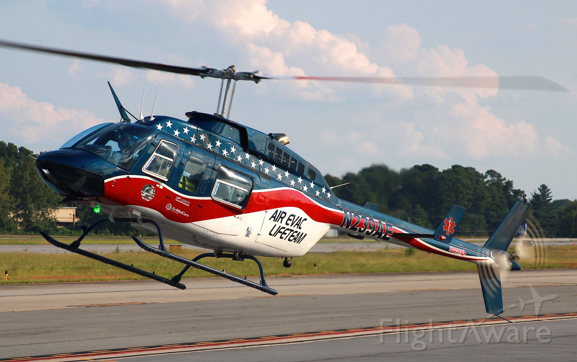 Bell JetRanger (N239AE) - It's hovering, not landing! Photo taken on 8/6/2021.