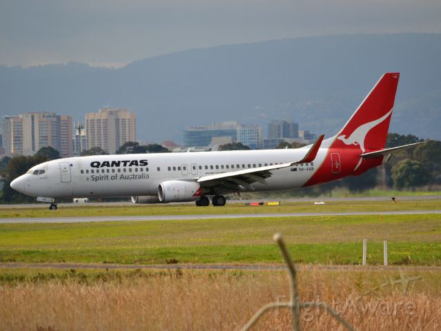 Boeing 737-800 (VH-VXR) - On taxi-way heading for Terminal 1 after landing on runway 23. Wednesday 4th July 2012.