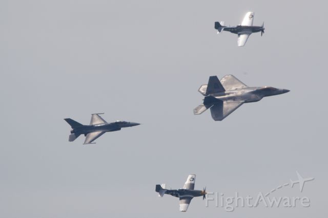 — — - USAF ACC Heritage Flight with two P-51s, an F-16 and F-22 in May 2019