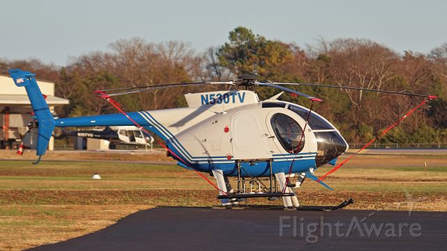 MD Helicopters MD 500 (N530TV) - December 2, 2018, Lebanon, TN -- This Tennessee Valley Authority (TVA) little bird is resting over the weekend at Lebanon Municipal Airport, awaiting its workweek flying the power grid of the Tennessee Valley. Vanderbilt Lifeflight's bird is in the background parked at outside its hanger across the field (N107VU).
