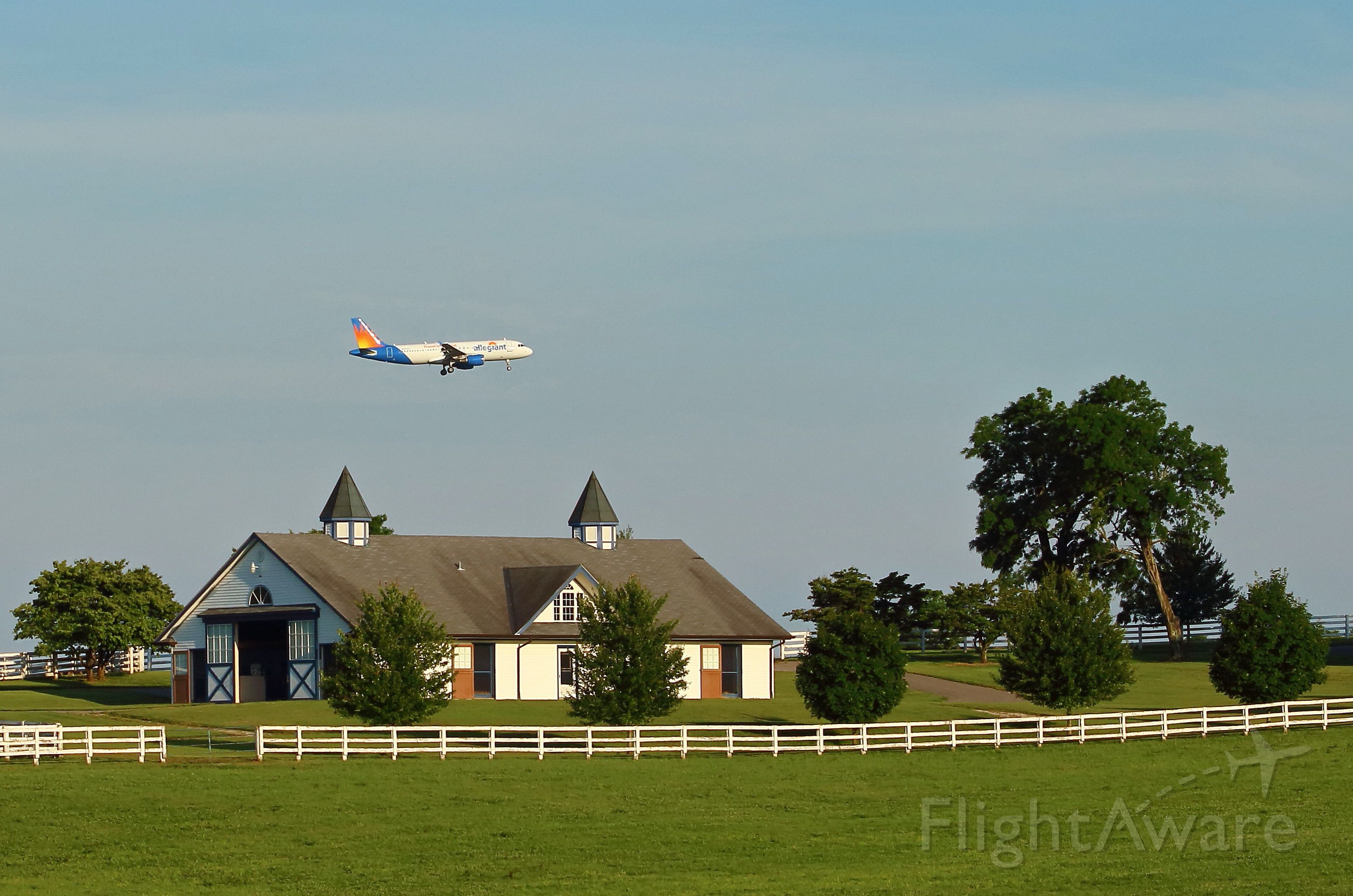 N219NV — - Allegiant (AAY) flight 1702 from Ft. Lauderdale, FL. KFLL USA flies near a beautiful horse barn near Bluegrass Airport, Lexington, Ky. KLEX USA.