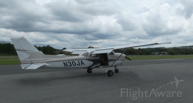 Cessna Skyhawk (N30JA) - Taxiing to departure is this 1976 Cessna Skyhawk 172M on this warrm overcast day in the Summer of 2021.