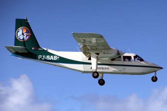 ROMAERO Islander (PJ-SAB) - On final approach for rwy 10 on 15-Nov-19.