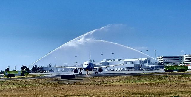 Airbus A319 (N815AW) - Just about a week ago, American Airlines began nonstop service from Spokane to Dallas (DFW) using their Airbus A319. Seen here taxiing underneath the water cannon salute as it commences the inaugural flight!