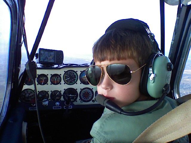 N88202 — - Caleb is flying front seat in the Citabria. He had his first take off and landing this day and was six years old at the time. Photo taken with Papas cell phone.