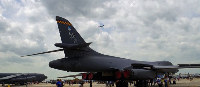 Rockwell Lancer (85-0077) - McGUIRE AIR FORCE BASE-WRIGHTSTOWN, NEW JERSEY, USA-MAY 14, 2016: Seen at the Open House and Air Show in the foreground is a B-1 Bomber, to the left is seen a B-52 Bomber and flying overhead is a B-2 Stealth Bomber.