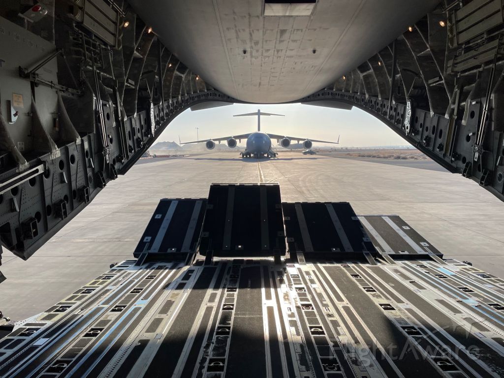 Boeing Globemaster III (07-7175) - Opening the ramp on a C-17A to see another sitting behind at Ali Al Salem Air Base, Kuwait. 07-7175 is the aircraft behind. Registration of host aircraft unknown.