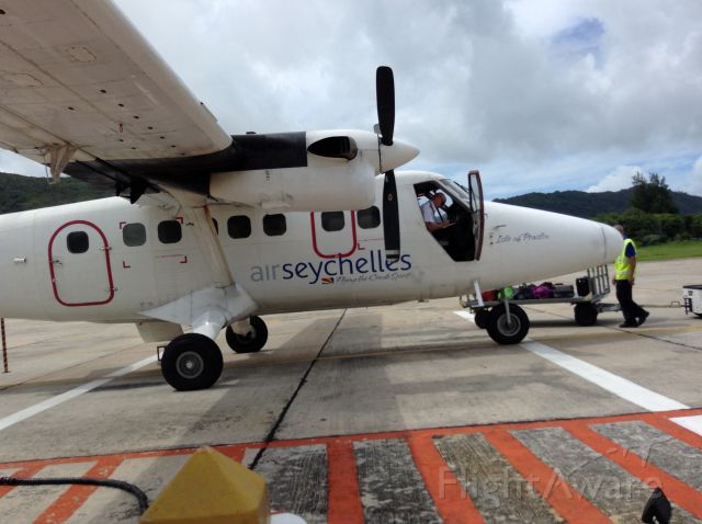 — — - Up close with the Twin Otter. Again the Air Seychelles flight making ready.