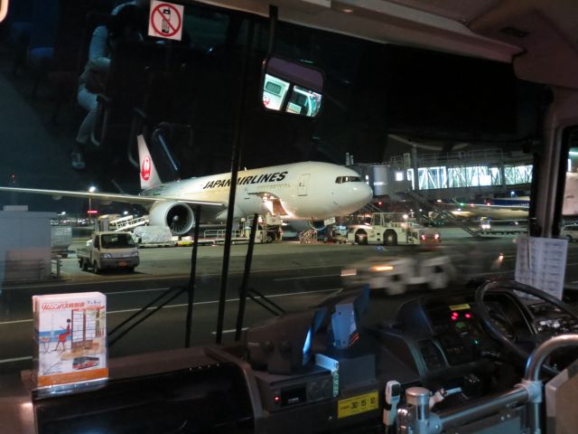 Boeing 777-200 — - Catching a bus to our flight at a remote gate