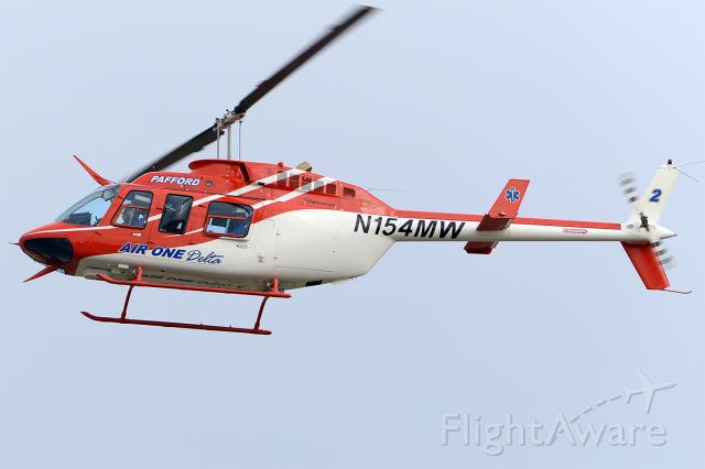 N154MW — - An L4 model drops in for a top-off. Same paint scheme as it had in the past, but different company name and logo. March 2013. 