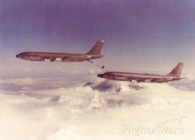 — — - RC-135D being refueled by a KC-135A tanker over Mt McKinley, Alaska