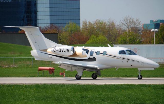 Embraer Phenom 100 (C-GVJV) - JV's Phenom 100 C-GVJV arriving @ Toronto's Buttonville - just arrived from Washington Dulles - and heading home to Lake Simcoe Regional Airport - May 19 2014