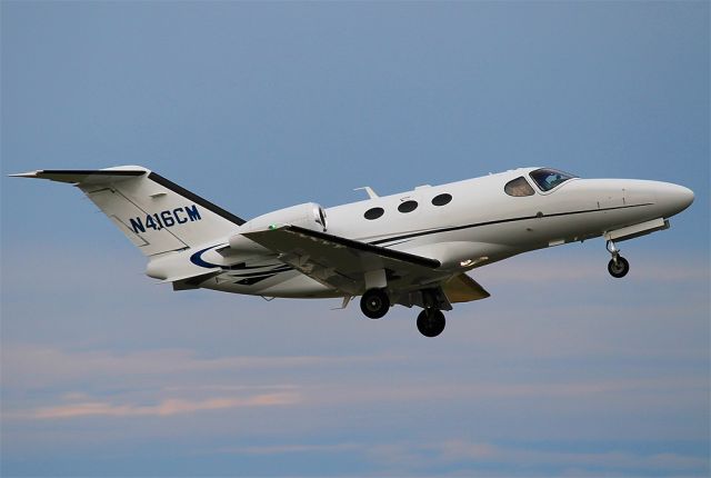 Cessna Citation Mustang (N416CM) - Departure off RWY24 at KACK. Notice person snapping their own pictures.