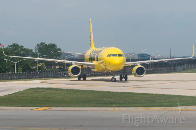 Airbus A320 (N644NK) - The Spirit banana bus taxiing and giving a flash to me while taking a scenic tour of ORD