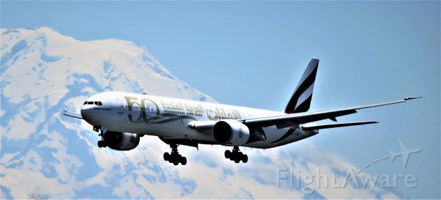 Boeing 777-200 (A6-EQM) - "Year Of The Fiftieth Livery"  Passing by Mt. Rainier, Seattle  6-26-2022