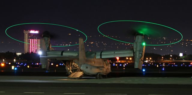 Bell V-22 Osprey (16-8018) - In this 10:05 PM photo, a VMM 163 MV-22B Osprey (168018) has just completed a "hot refuel" (props continue to run while the aircraft is refueled) and is preparing to lift off from the Atlantic Aviation ramp.  NOTE: Smoke from a lightning-caused wildfire burning northwest of the airport was drifting in at ground level and the green light was reflecting off the dense smoke, creating a green "cloud" near the starboard prop.