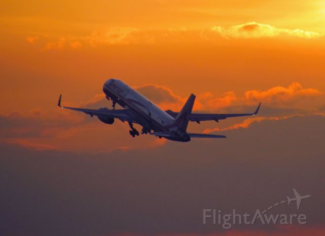 Boeing 757-200 (N664AA) - Ship 5CM climbing off of RWY 26L at sunset