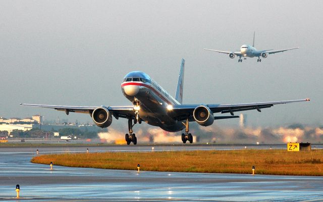 Boeing 757-200 (N689AA) - early morning takeoff from R-8L while a Tampa Cargo B-767 is on short final to R-8R
