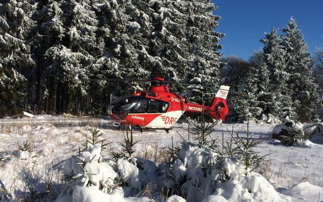 Eurocopter EC-635 (D-HDRT) - EC-H135 rescue helicopter , landing near the forest (DRF)br /injured skier -
