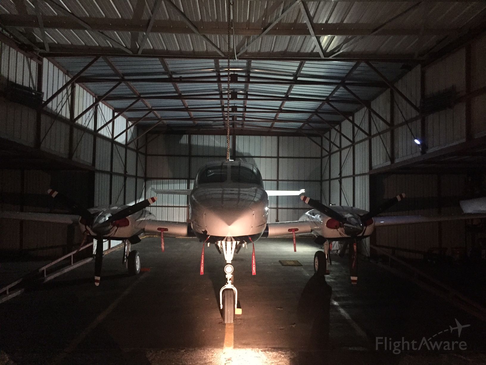 Cessna 335 (N335PW) - Night time pic in the hanger with the tow lights on!