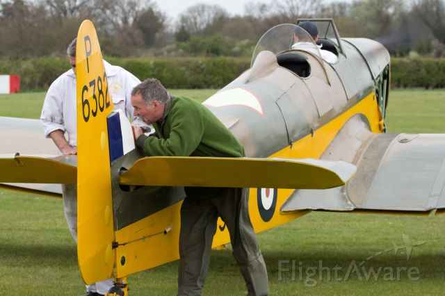 — — - Engine run up. Note the Pilots pants/trousers receiving the full blast from the prop wash.