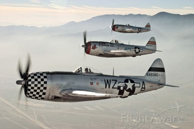 NX47DF — - Three Republic P-47D Thunderbolts in flight above southern California.
