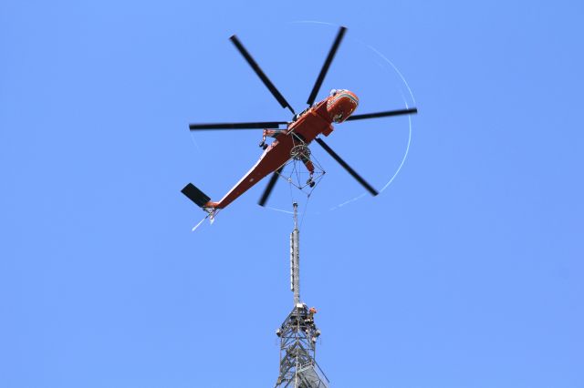 Sikorsky CH-54 Tarhe (N163AC) - This was very cool. We had the Air Crane lift our new UHF TV antenna to the top of our 1868 ft tall tower near Orlando FL. You can see the vapor trails streaming from the blade tips. The antenna weighed 14,000 lbs.