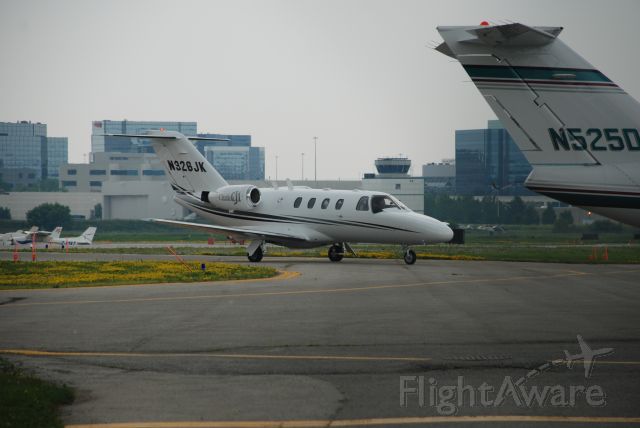 Cessna Citation CJ1 (N326JK) - Taken at Buttonville Toronto on July 8/08, Cessna CJ arriving from Oakley Kansas.