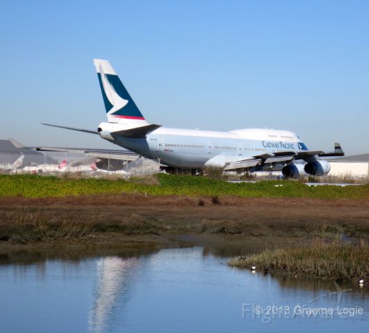 Boeing 747-400 (B-HUG) - From the Bayshore Trail in Millbrae, CA, spotting a Cathay Pacific B-747-462, Flight CX879, depart for HKG.