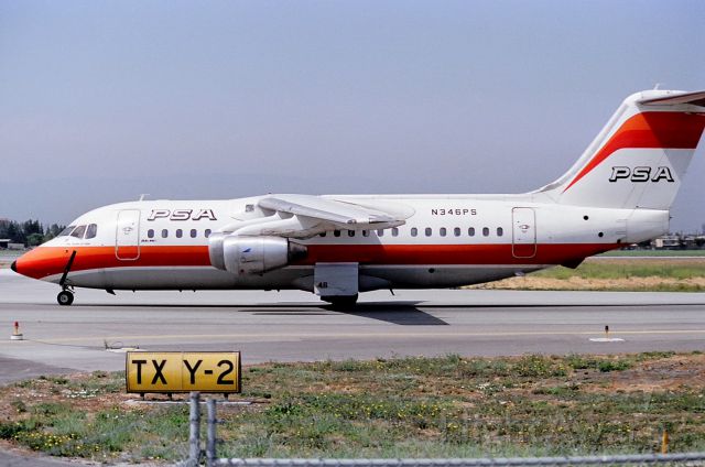 British Aerospace BAe-146-200 (N346PS) - KSJC - Mar 1987-ish - PSA BAe-146 on taxi to terminal C at San Jose - photo taken from the temporary parking lot built adjacent to the taxi ways while Terminal A was being built pre 1990.br /br /br /br /Serial number 2022 LN:22br /Type Bae 146-200br /First flight date 16/05/1984