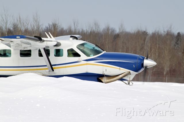 Cessna Caravan (N4118K) - A Caravan flown by Air Choice One taxis past a snowbank