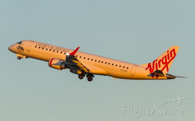 Embraer ERJ-190 (VH-ZPF) - Whitehaven Beach climbs out into the morning glow