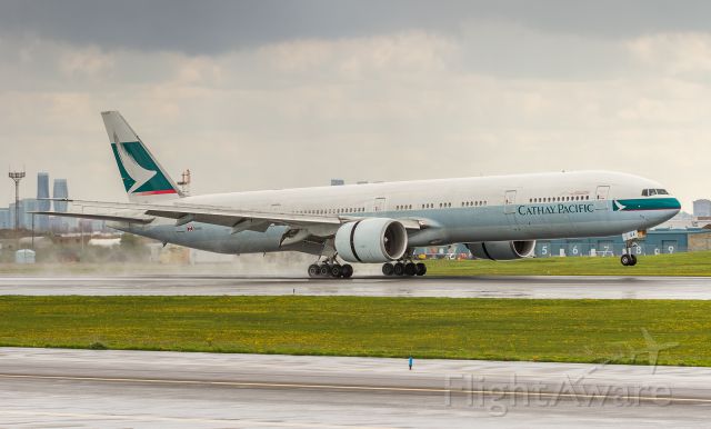 BOEING 777-300ER (B-KQA) - CX828 touches down on runway 33L at YYZ arriving from Hong Kong