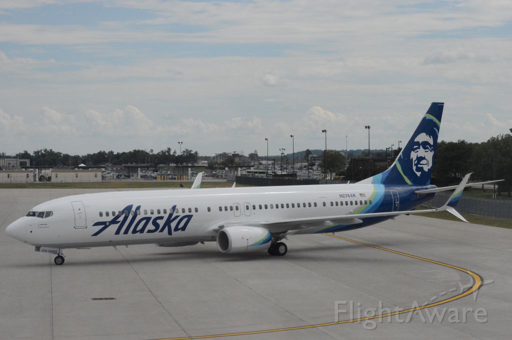 Boeing 737-900 (N274AK) - Alaska Airlines flight 718 is pulling into Gate A9 at 3:33 PM CDT.  This flight was flown on what was then Alaskas newest aircraft.  Photo taken July 28, 2017 with Nikon D3200 mounting 55-200mm VR2 lens.