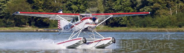 — — - Shark Aviation's amphibious Cessna 185 taking off on the Ohio River near Rising Sun, Indiana