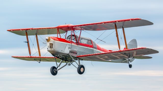 OGMA Tiger Moth (C-FPHZ) - This Thruxton Jackaroo originated as a De Havilland Tiger Moth DH82A and was converted in 1958. There are not many of these still flying but here is one in flight over Guelph, Ontario, Canada.