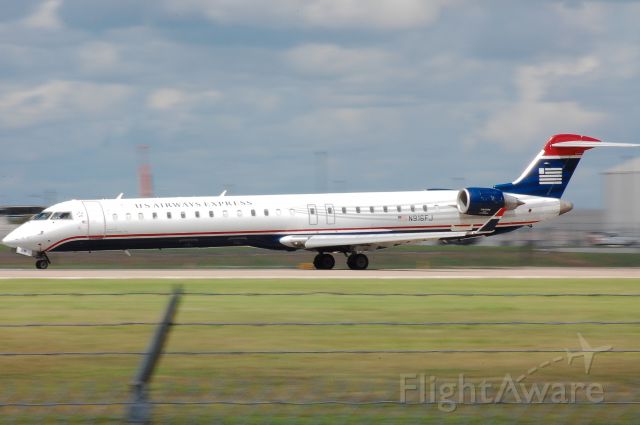 Canadair Regional Jet CRJ-900 (N916FJ) - An attempt at a decent panning shot from the official Family Viewing Area at Austin Bergstrom Airport.