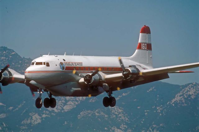 Douglas C-54 Skymaster (N96358) - Douglas C-54E N96358 tanker #160 on approach to Runway 25 at Santa Barbara during the Bouquet Canyon Fire on May 11, 2002.