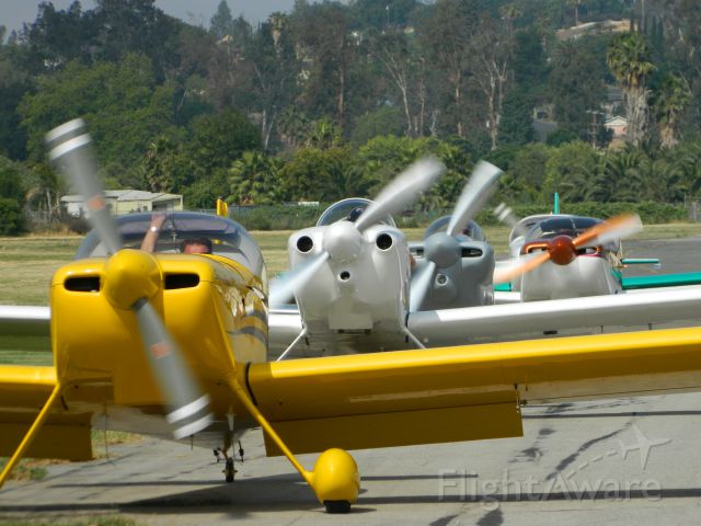 — — - After doing a series of flyovers, The club from KRAL taxis to the apron to grab lunch at the Flabob Airport Cafe