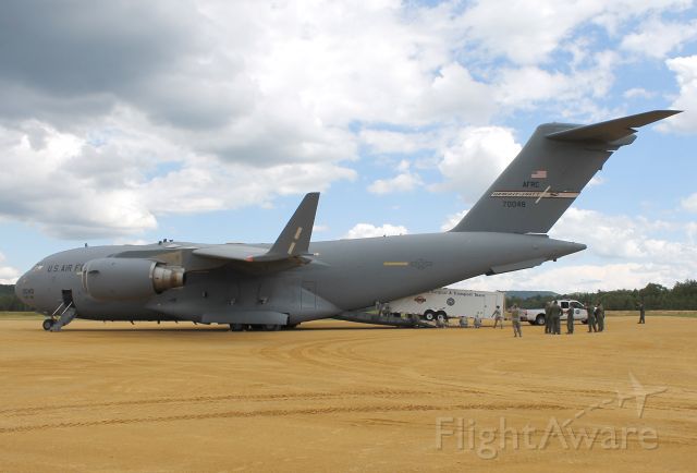 Boeing Globemaster III (97-0048) - Florida Advanced Surgical Transport Team (FAST) and equipment from Miami, Florida, being offloaded from a USAF C-17 Globemaster III, 97-0048, from the 445th Airlift Wing, Wright-Patterson AFB, OH, on 26 Jul 2013. Ft. McCoy and nearby Young Air Assault Strip was host to a joint-services field training and mass casualty exercise-Warrior Exercise 86-13-01 (WAREX).