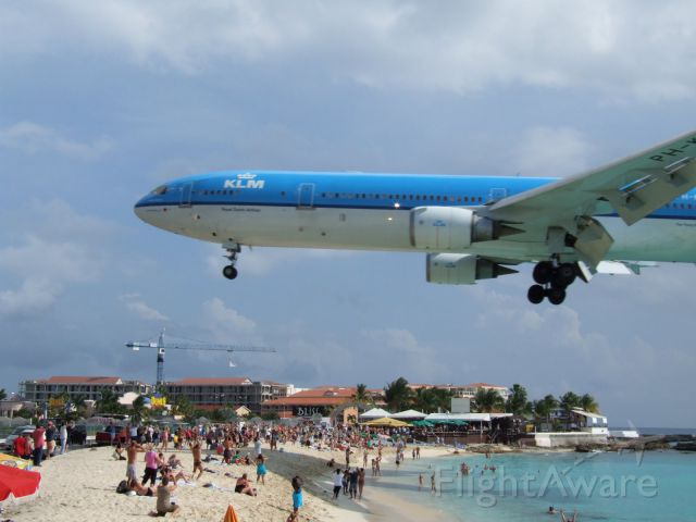 Boeing MD-11 (PH-KCE) - Blurry, but I was eating pizza at The Boat Bar when I took it....
